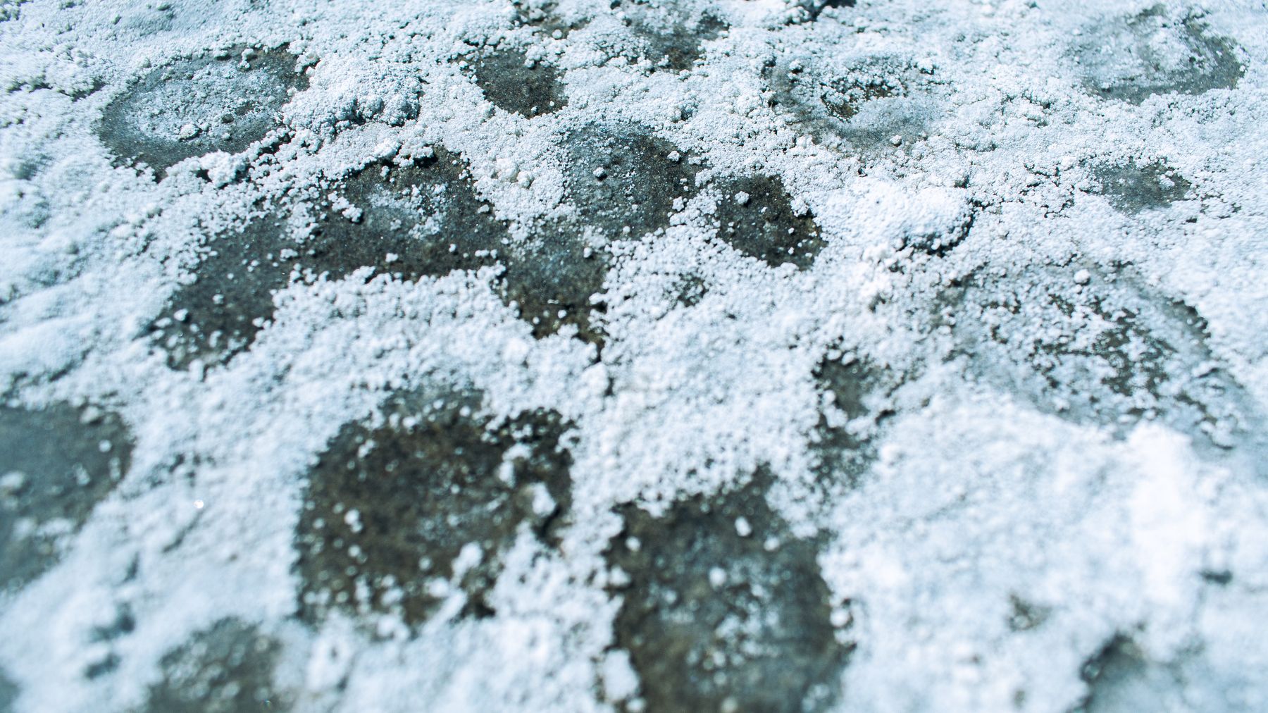 Fine white sea salt flakes forming a natural pattern