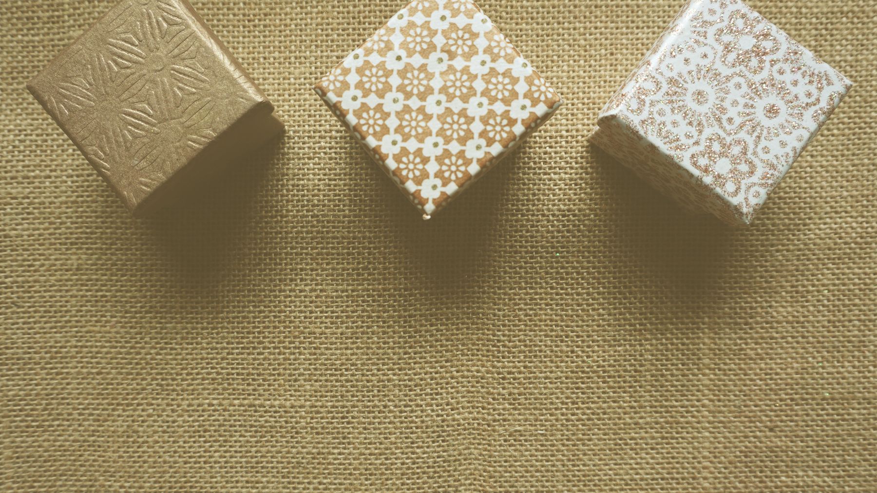 Gift boxes presented on natural burlap