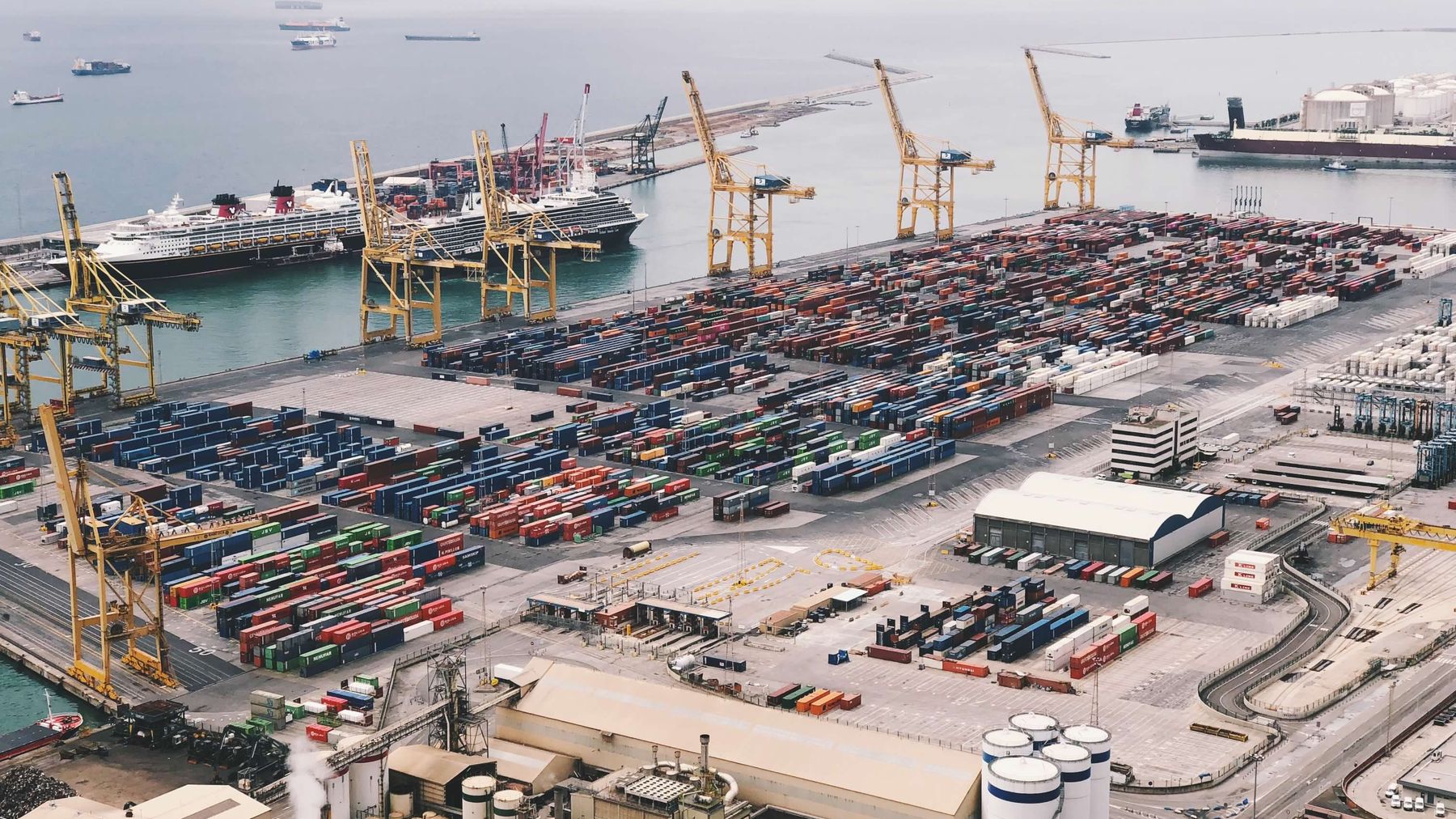 Port cranes loading cargo for export